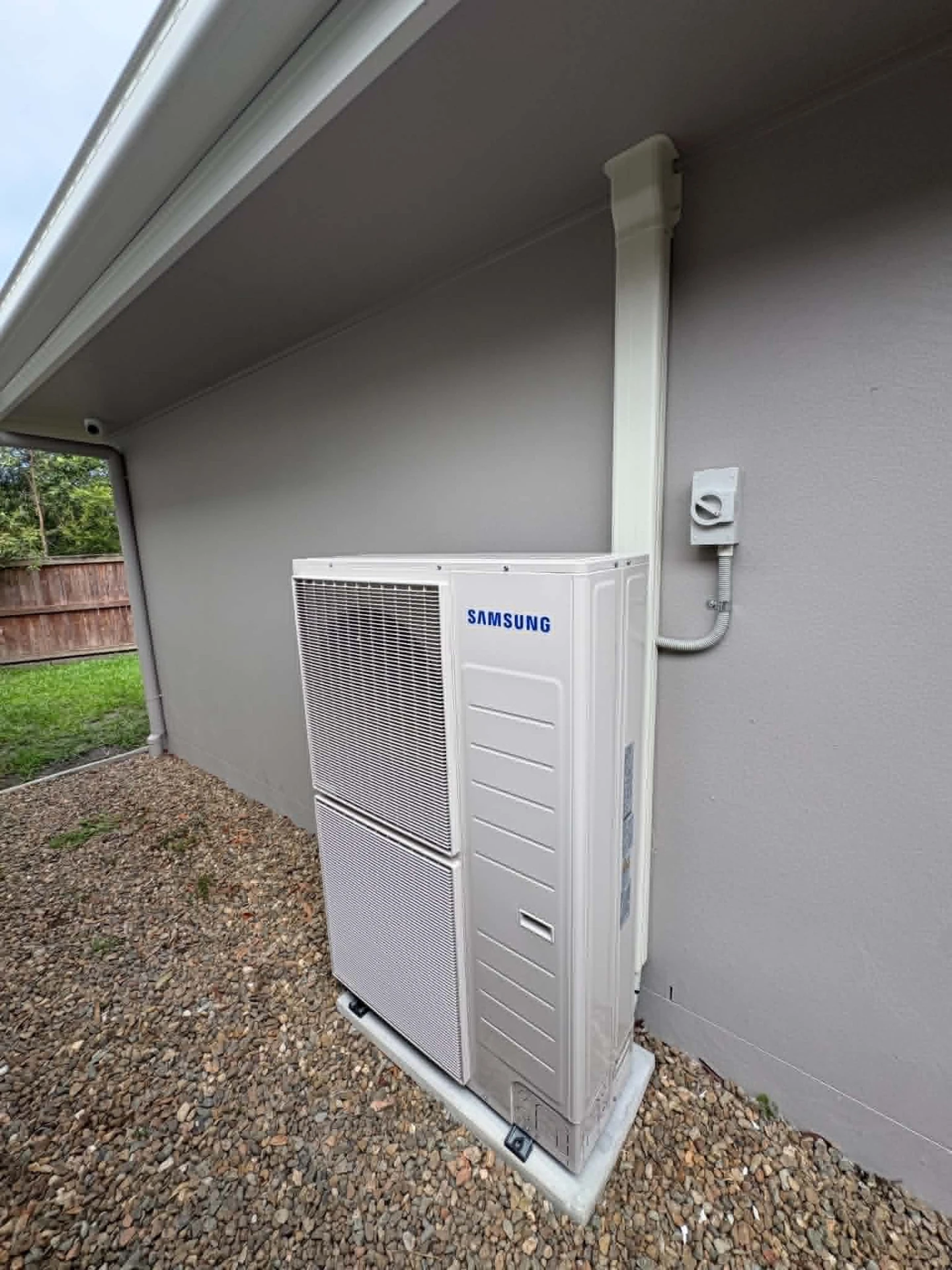 Samsung ducted air conditioning outdoor unit installed beside a new Sunshine Coast home